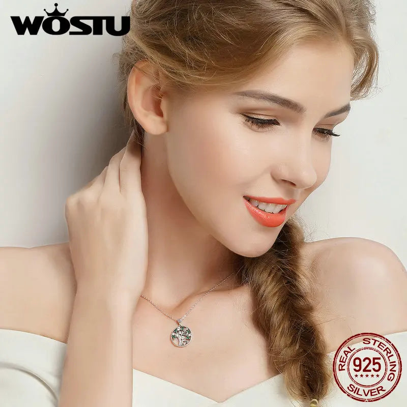 Woman wearing a necklace with a visible brand logo on a light background