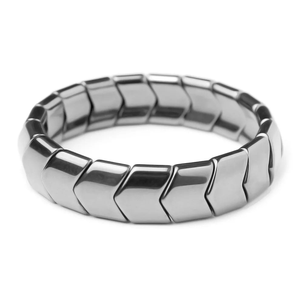 Silver ring with a textured pattern on a white background