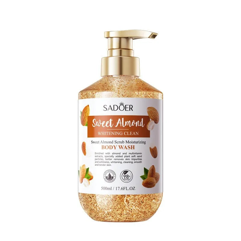Body wash bottle with gold pump and almond design on a white background