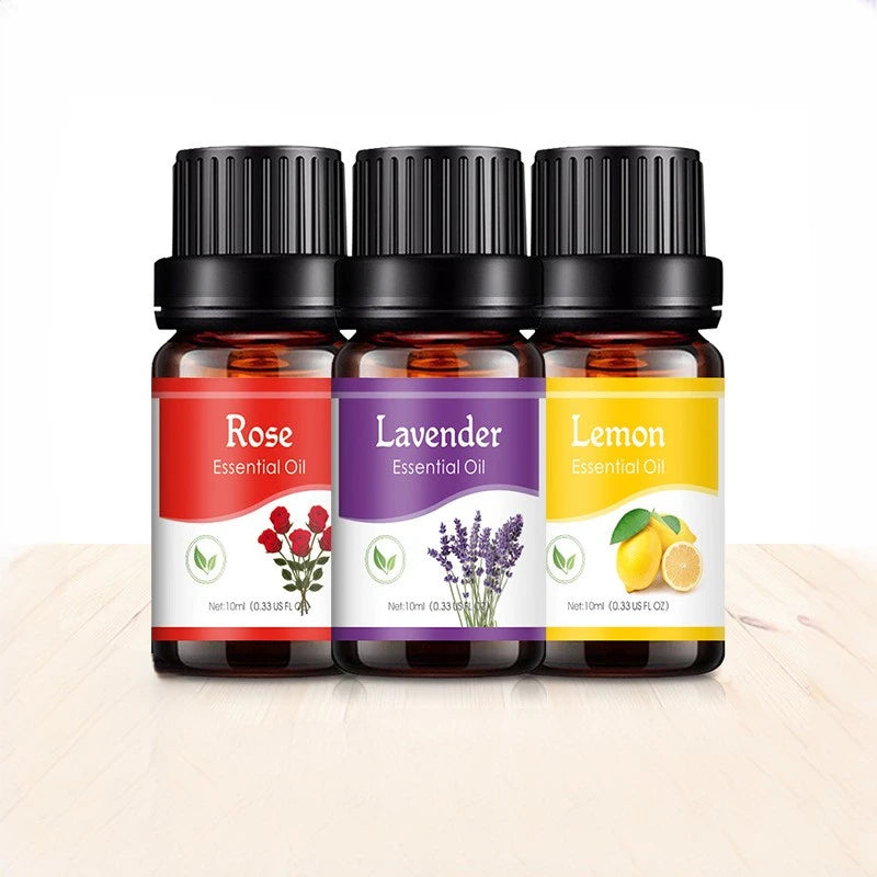 Three essential oil bottles labeled 'Rose', 'Lavender', and 'Lemon' on a white background.