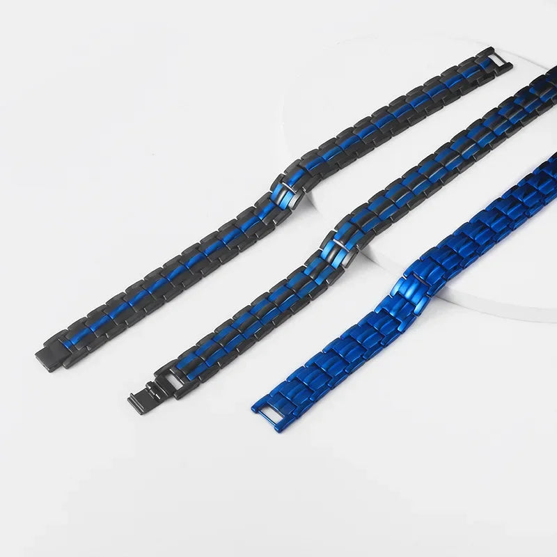 Two watch straps, one black with blue accents and one blue, on a white background.
