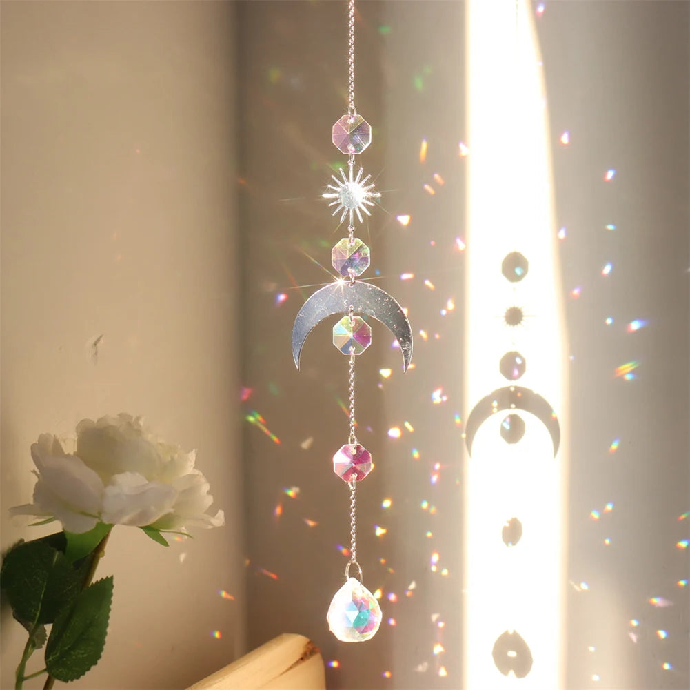 Decorative hanging crystal with rainbow, placed against a neutral background.