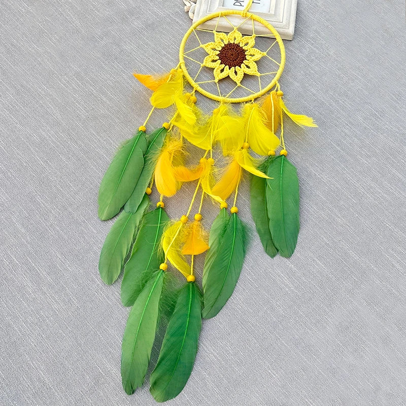 Yellow and green dreamcatcher on a gray textured background