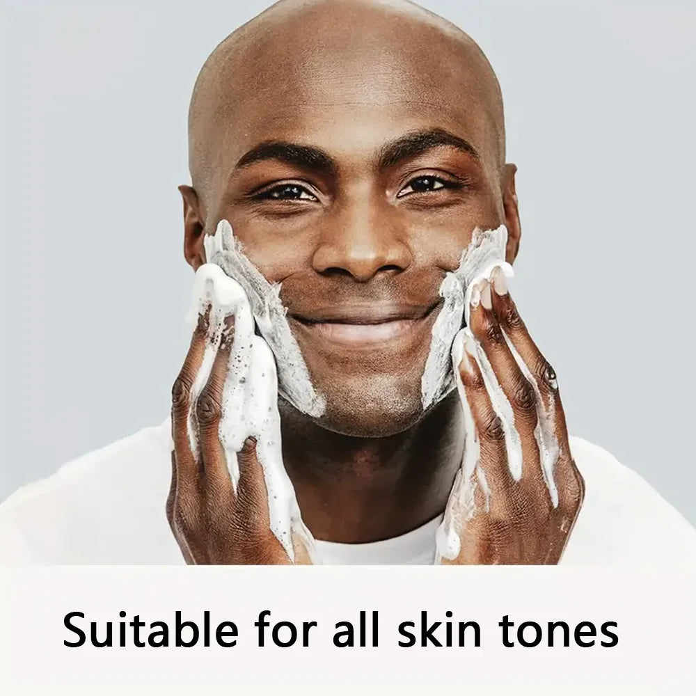 Man applying a skincare product with text 'Suitable for all skin tones' on a gray background