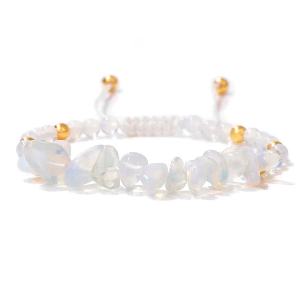 Opalite bracelet with gold accents on a white background