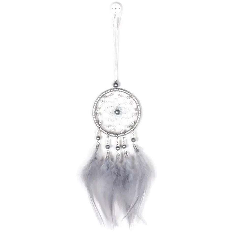 Dreamcatcher with feathers on a white background