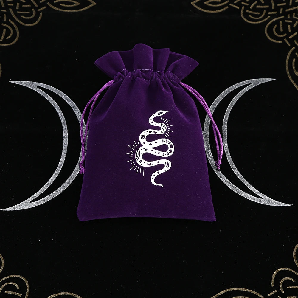 Purple drawstring bag with a snake design on a black background with moon symbols.