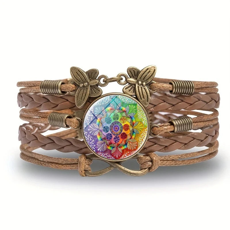 Brown braided bracelet with a colorful circular charm featuring floral designs on a white background