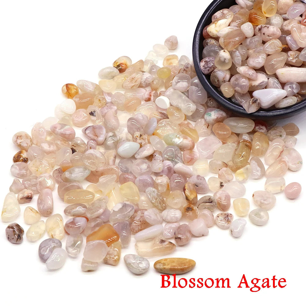 Blossom Agate stones with a bowl on a white background