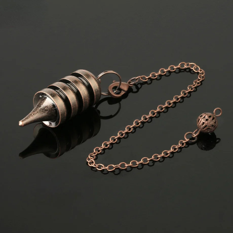 Bronze-colored metal cone with chain on a black background