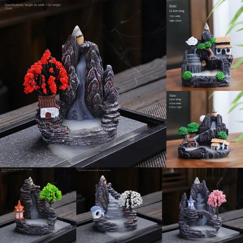 Collage of decorative mountain and tree sets with various elements on a table.