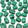 Green malachite beads on a white background
