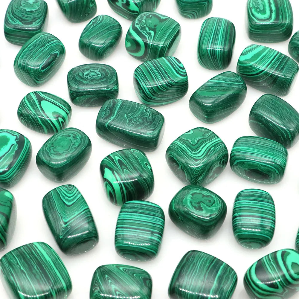 Green malachite beads on a white background