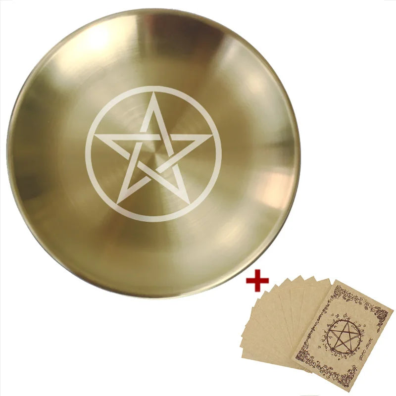 Gold dish with pentagram design and additional cards on a white background