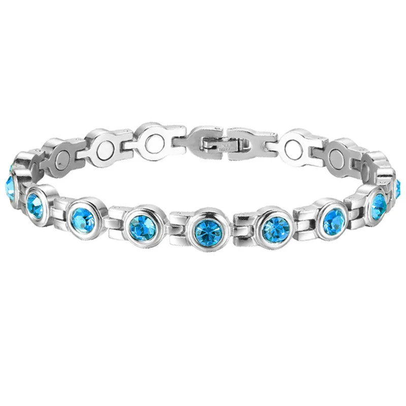 Silver bracelet with blue gemstones on a white background