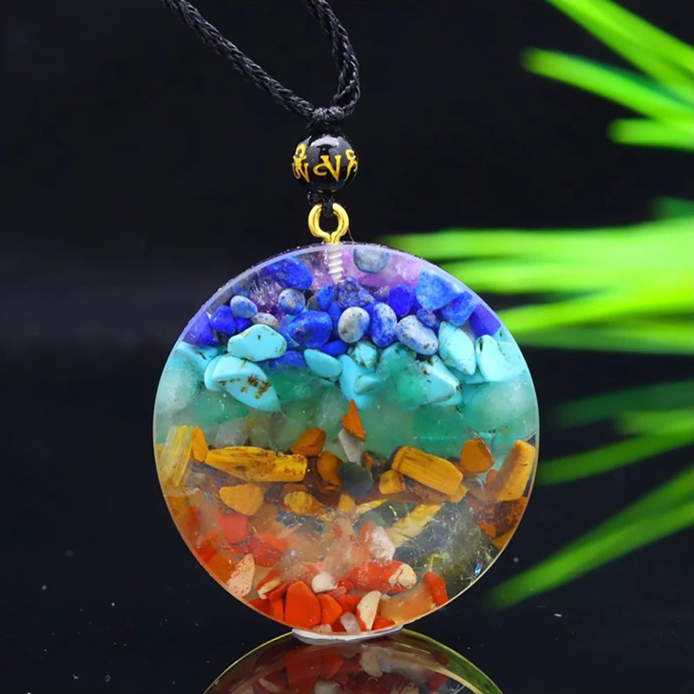 Colorful pendant with embedded stones on a black background