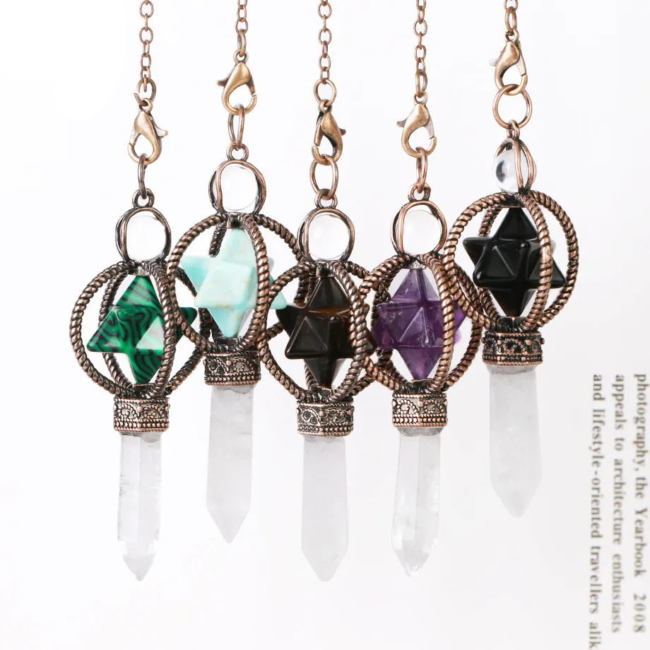Five crystal pendants on chains with colored stones and clear crystals against a white background.
