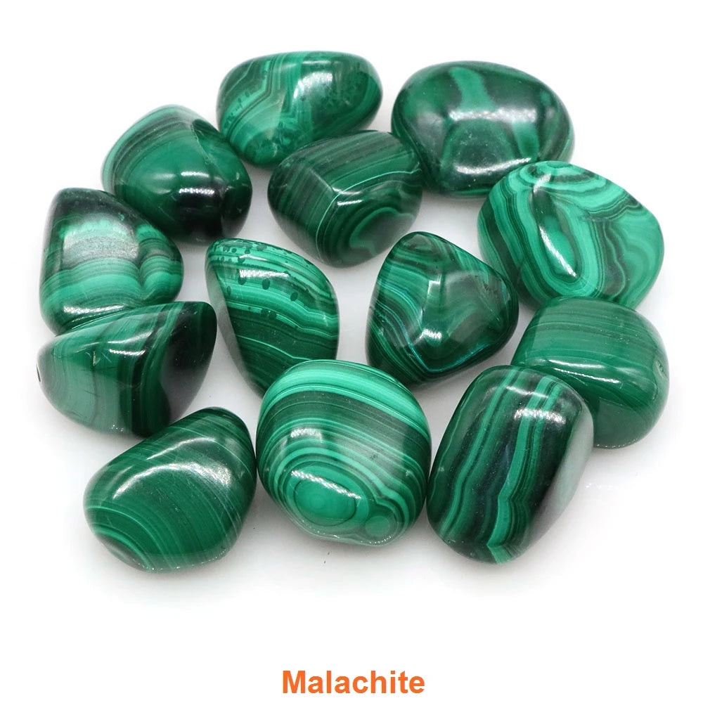 Collection of green malachite stones on a white background