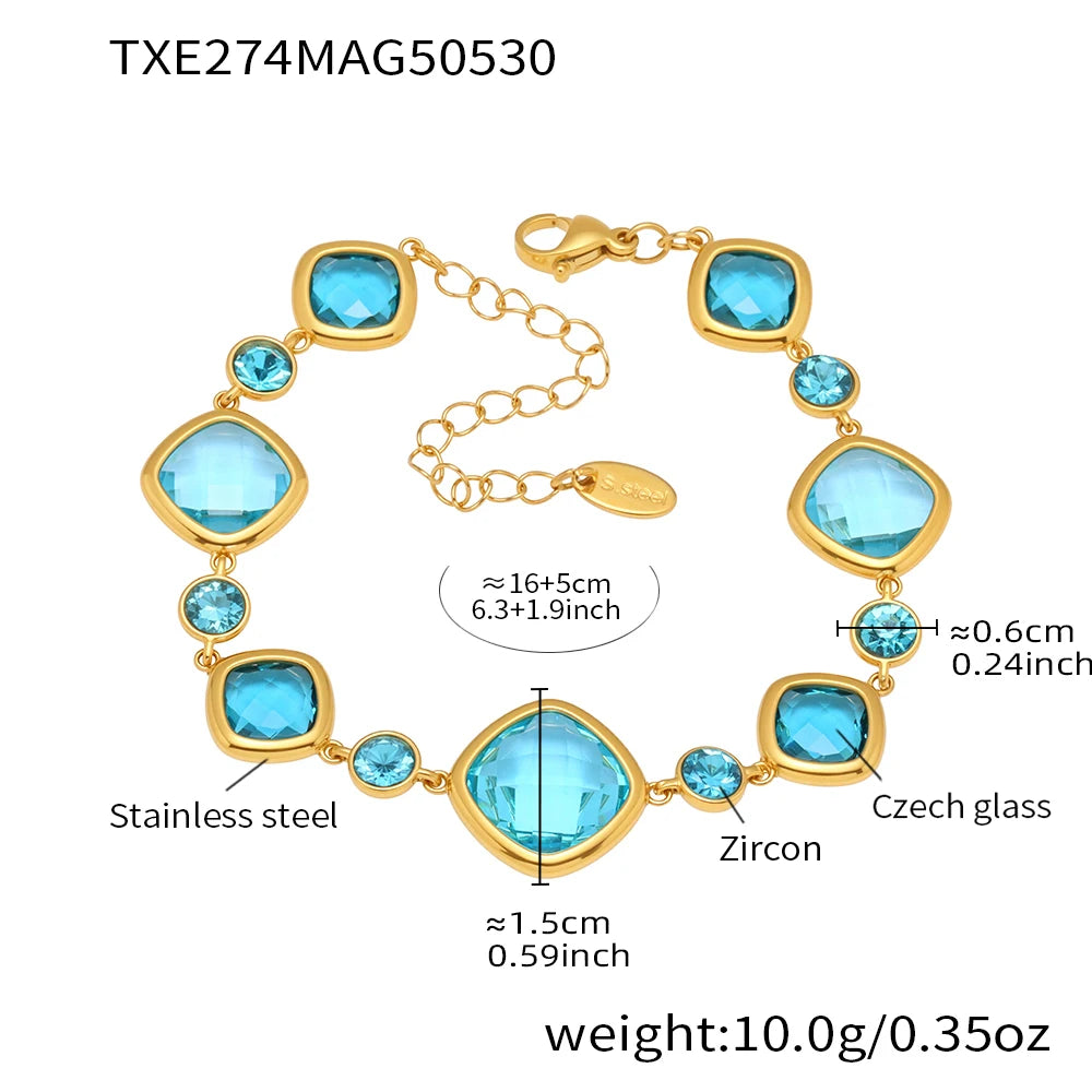 Gold bracelet with blue gemstones and measurements on a white background