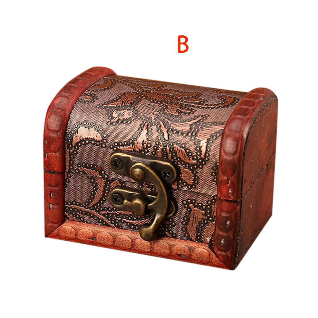 Decorative jewelry box with intricate patterns and a brass clasp on a white background