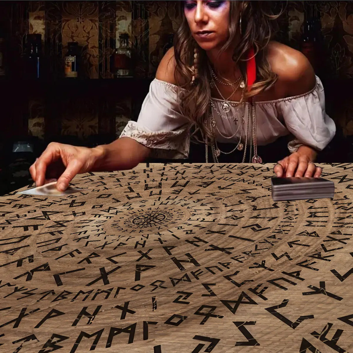 Woman performing a reading with runes on a table