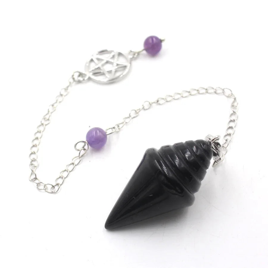 Black pendulum with purple beads on a silver chain against a white background
