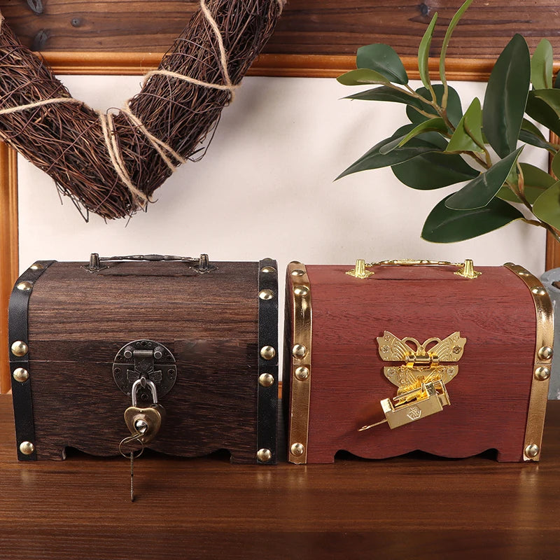 Two wooden treasure chests with decorative elements on a wooden surface.
