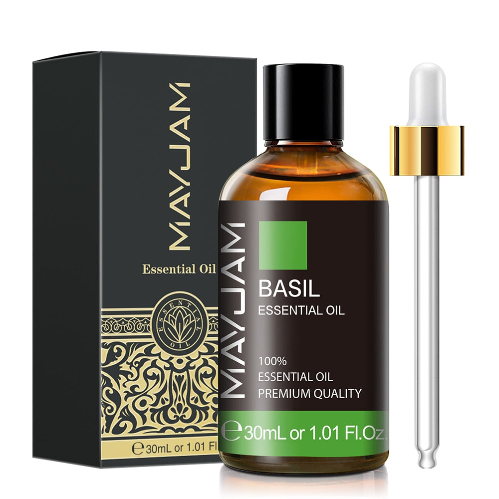 Basil essential oil bottle with dropper and packaging on a white background