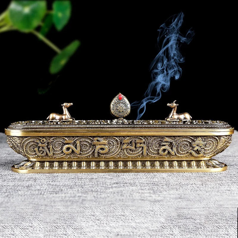 Decorative incense holder with smoking incense on a textured surface