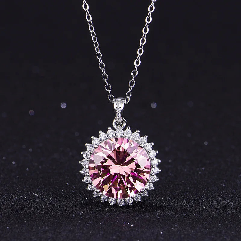 Necklace with a pink gemstone pendant on a black background