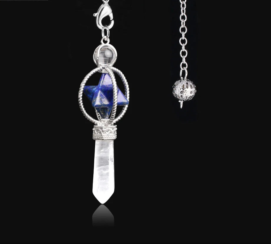 Jewelry pendant with blue gemstone and crystal on a black background