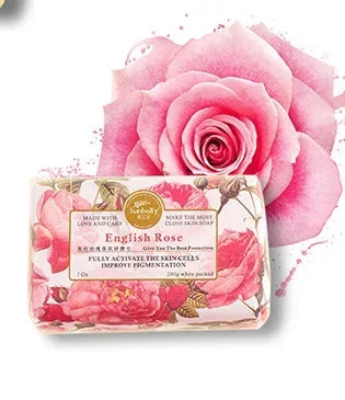 Soap bar with 'English Rose' packaging in front of a pink rose