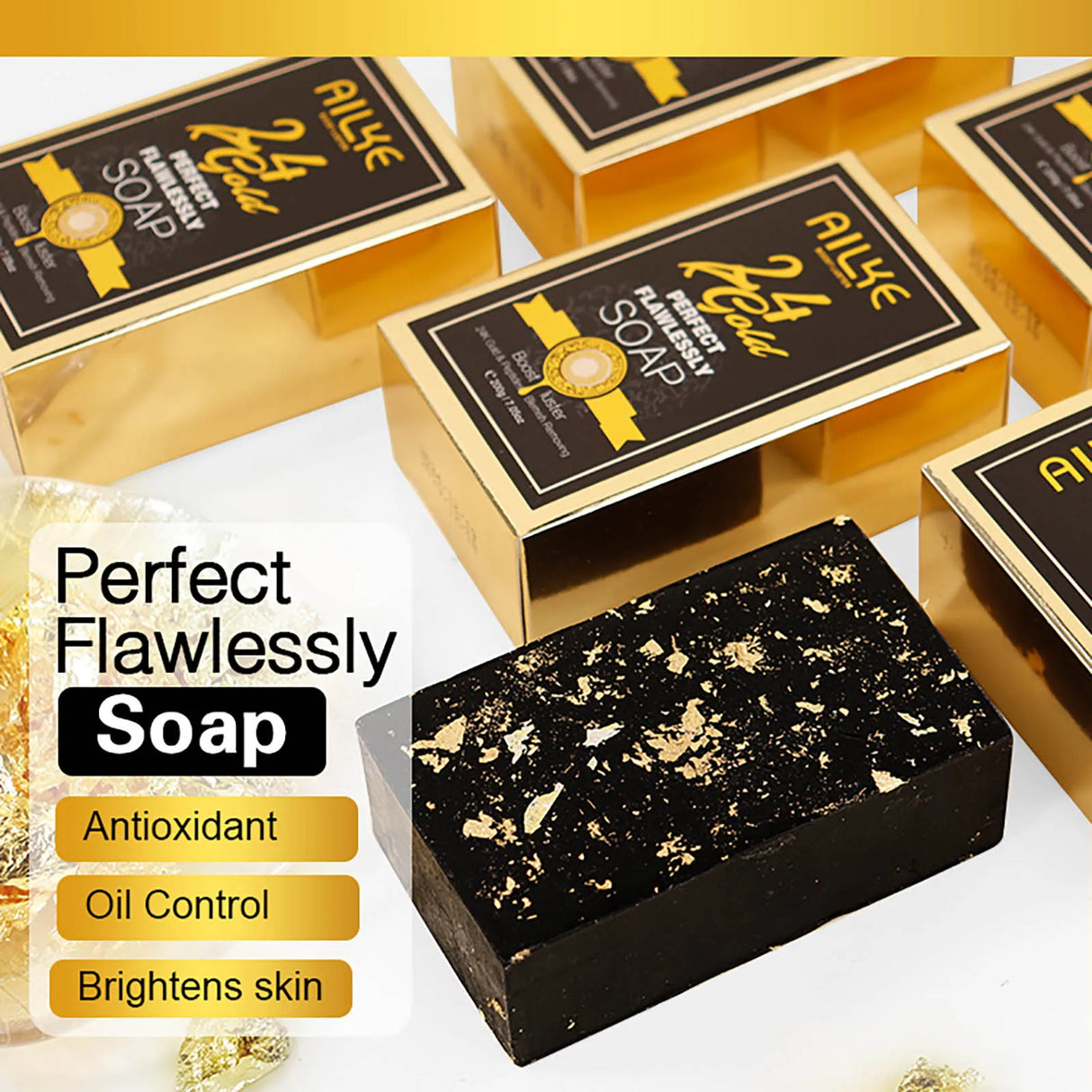 Black and gold soap bar with packaging on a white background