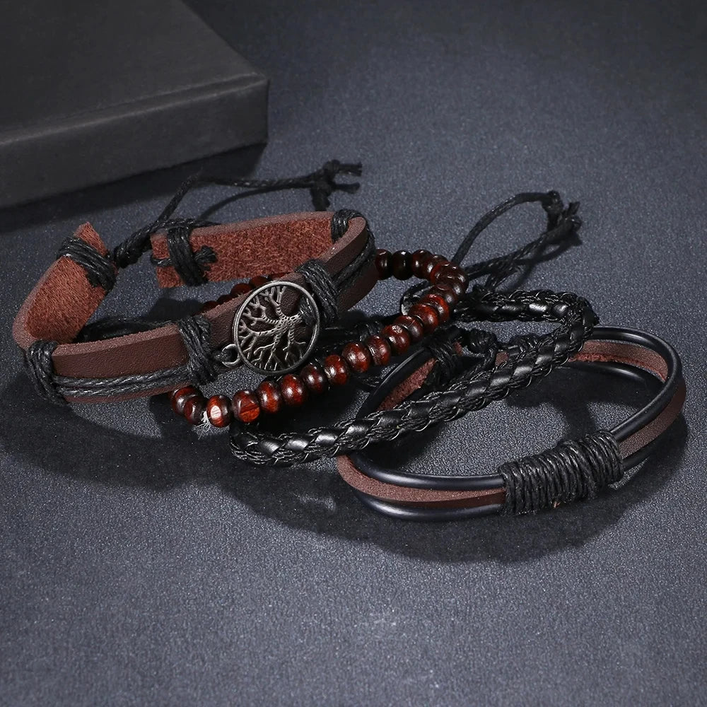 Set of braided leather and beaded bracelets on a dark surface