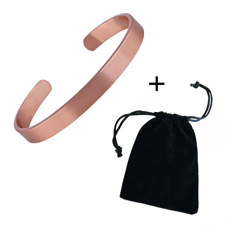 Pink metal bracelet with a black drawstring bag on a white background