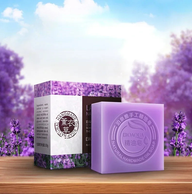 Purple soap bar and packaging with lavender flowers in the background
