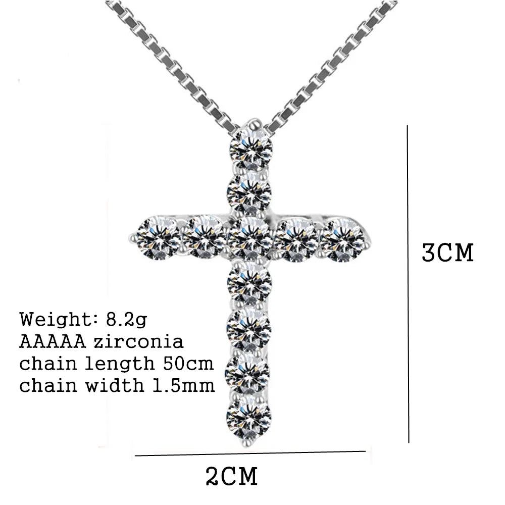 Silver cross pendant necklace with zirconia stones on a white background, showing measurements.