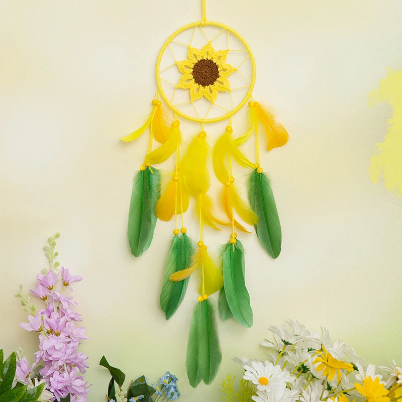 Decorative wall hanging with sunflower design and feathers on a light yellow background.