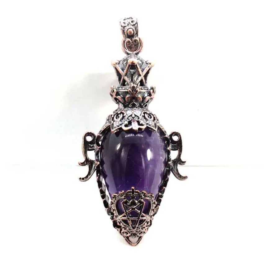Purple pendant with intricate metalwork on a white background