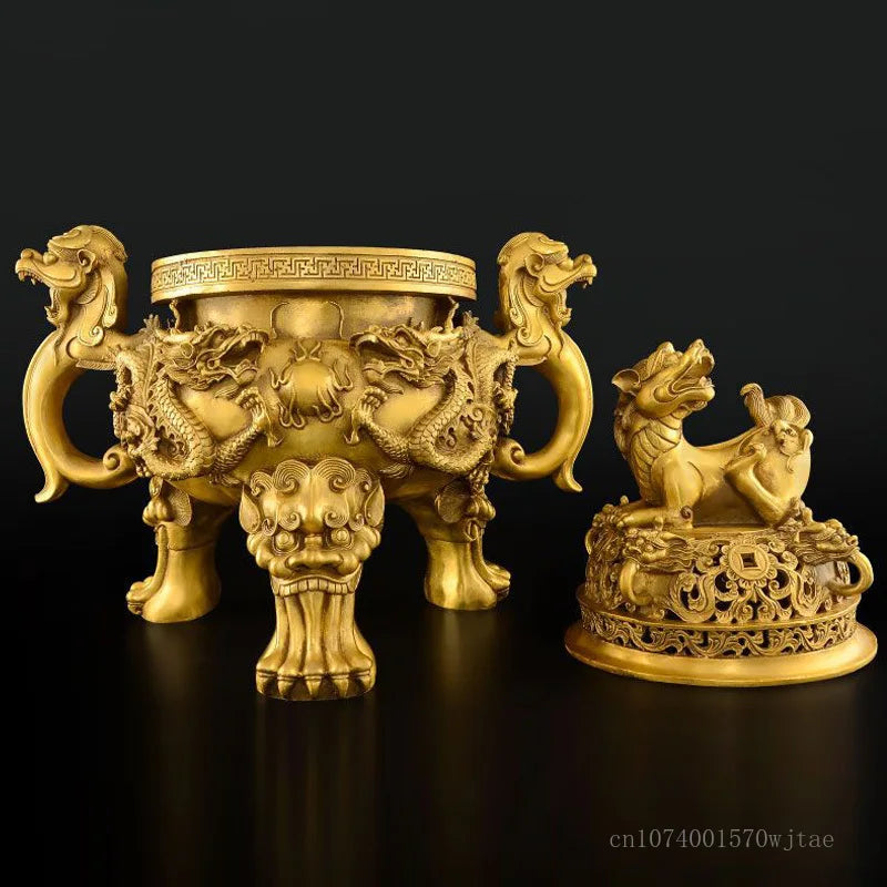 Two ornate gold sculptures on a black background