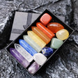 Set of colorful crystals in a box on a textured surface