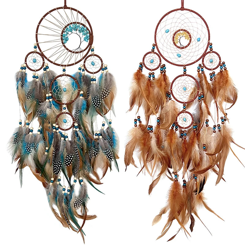 Two dreamcatchers with feathers on a white background