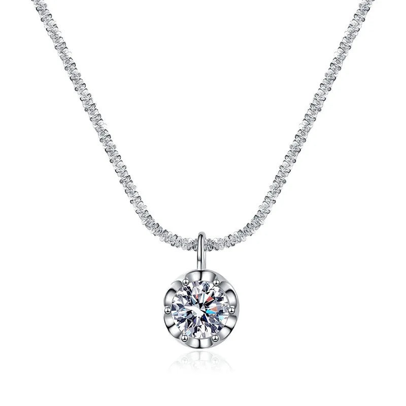 Silver necklace with a round pendant on a white background