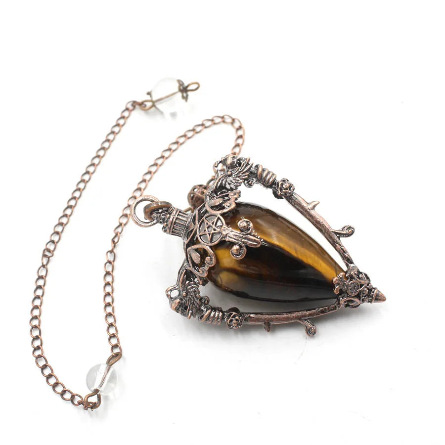 Necklace with a large brown gemstone and intricate metalwork on a white background