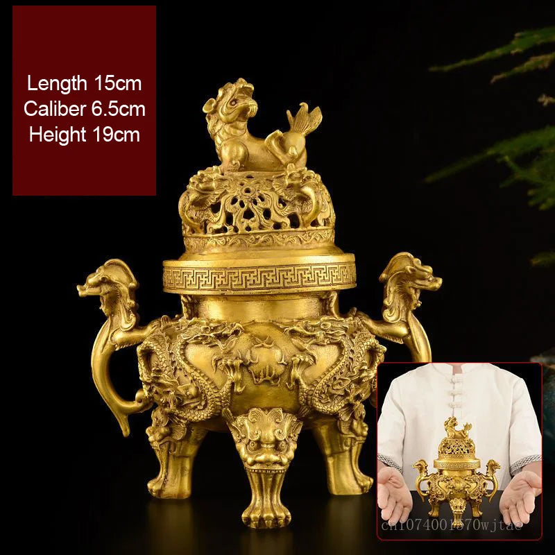 Gold-colored incense burner with intricate designs on a dark background