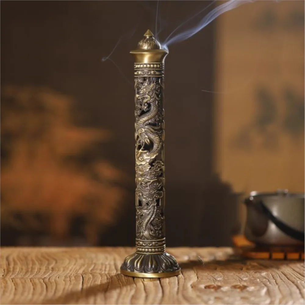 Decorative incense stick with dragon design on a wooden surface