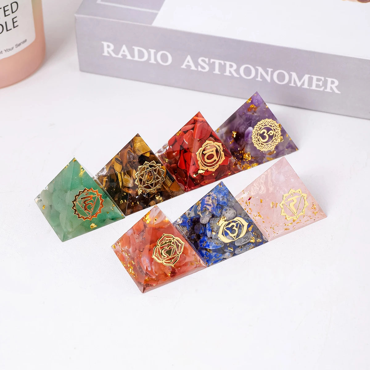 Colorful crystal pyramids with gold symbols on a white surface, branded 'Radio Astronomer'.