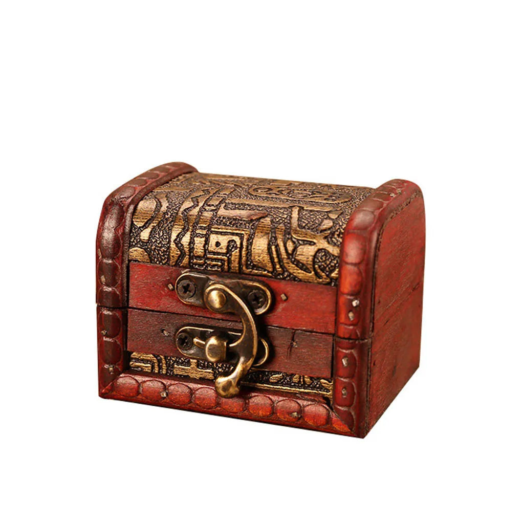Decorative wooden chest with intricate carvings and a gold lock on a white background