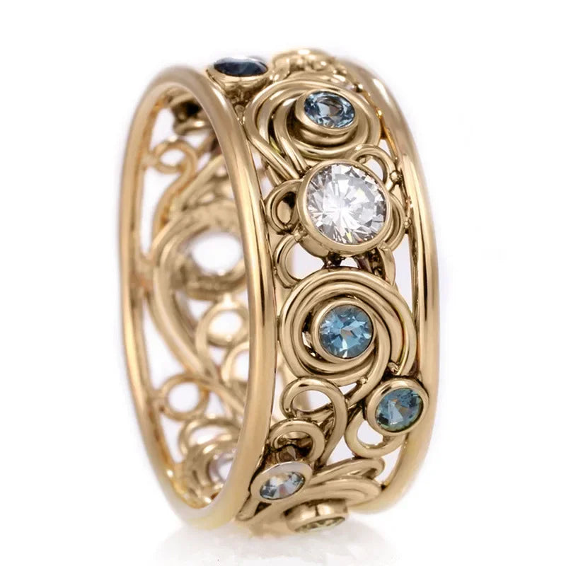 Gold ring with gemstones on a white background