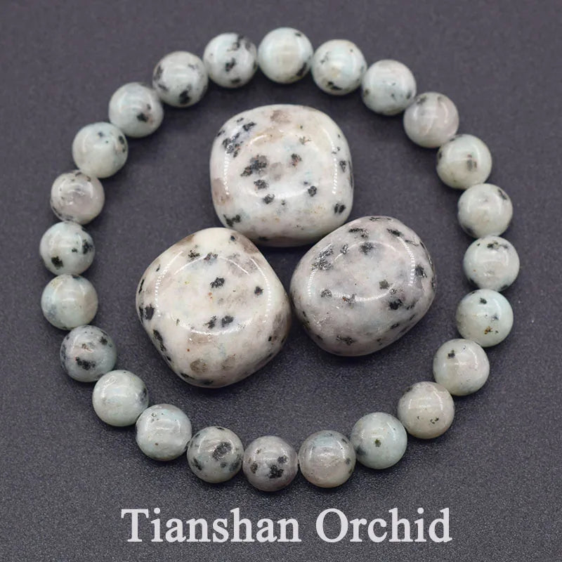 Necklace with white beads and larger stones on a gray background, featuring 'Tianshan Orchid' branding.